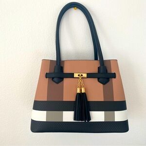 Classy& Stylish leather bag in black white and brown.